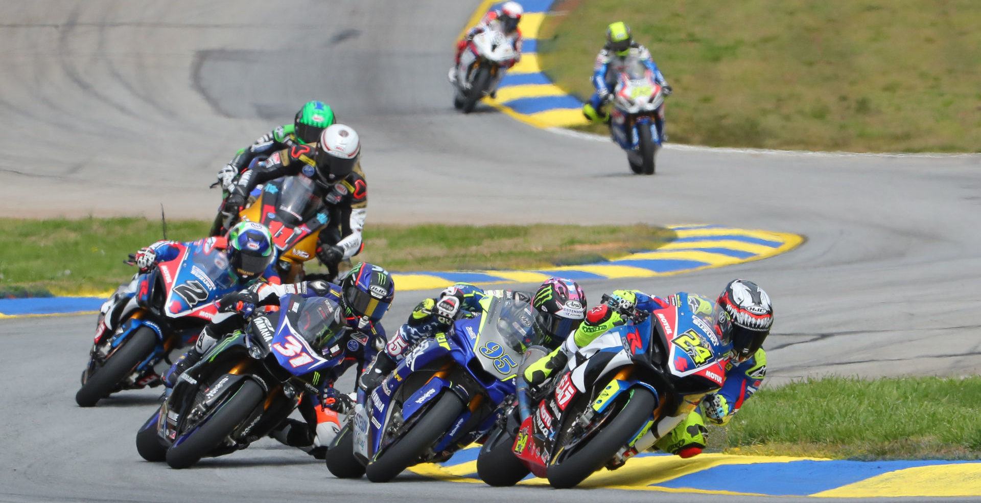 Toni Elias (24) leading JD Beach (95), Garrett Gerloff (31), Josh Herrin (2), Mathew Scholtz (11), Cameron Beaubier, Jake Lewis, and Jake Gagne during a MotoAmerica Superbike race at Michelin Raceway Road Atlanta in 2019. Photo by Brian J. Nelson.