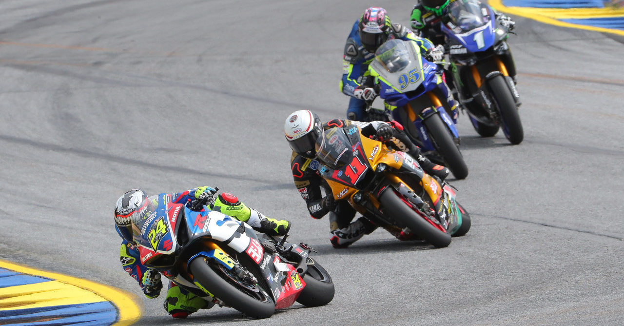 Toni Elias (24) leads Mathew Scholtz (11), JD Beach (95), and Cameron Beaubier (1) during a MotoAmerica Superbike race at Road Atlanta in 2019. Photo by Brian J. Nelson.