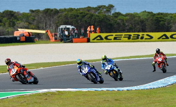 Wayne Maxwell (47) leads Cru Halliday (65), Josh Waters (21), and Troy Herfoss (17) during Race Three at Phillip Island. Photo by Russell Colvin, courtesy of Motorcycling Australia.