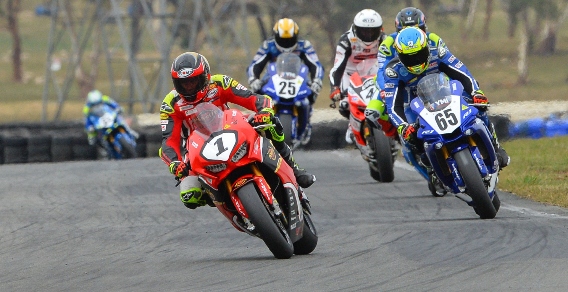 Former Australian Superbike Champion Troy Herfoss (1) leads Cru Halliday (65) and the rest of the Australian Superbike field at Wakefield Park in 2019. Photo by Russell Colvin, courtesy of Motorcycling Australia.