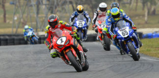 Former Australian Superbike Champion Troy Herfoss (1) leads Cru Halliday (65) and the rest of the Australian Superbike field at Wakefield Park in 2019. Photo by Russell Colvin, courtesy of Motorcycling Australia.