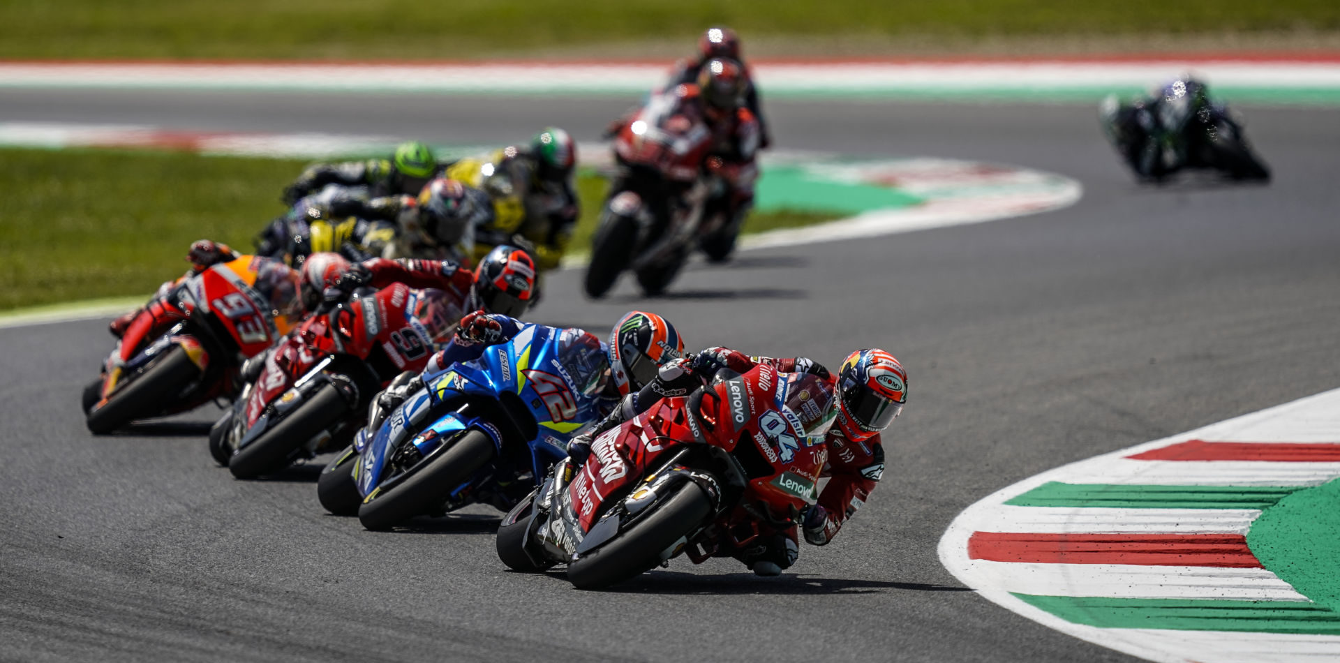 Andrea Dovizioso (04) leading Alex Rins (42), Danilo Petrucci (9), Marc Marquez (93), and the rest of the field during the 2019 Italian Grand Prix at Mugello. Photo courtesy of Dorna/www.motogp.com.