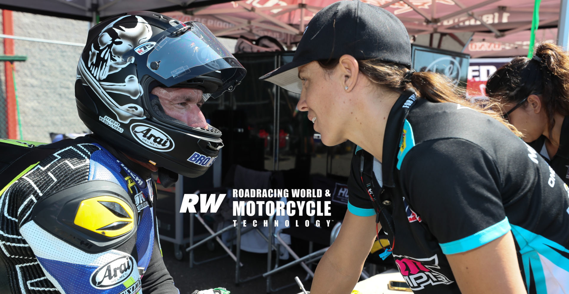 Josh Hayes (left) with his wife, MP13 Racing team owner and MotoAmerica racer Melissa Paris, at New Jersey Motorsports Park in 2019. Photo by Brian J. Nelson.