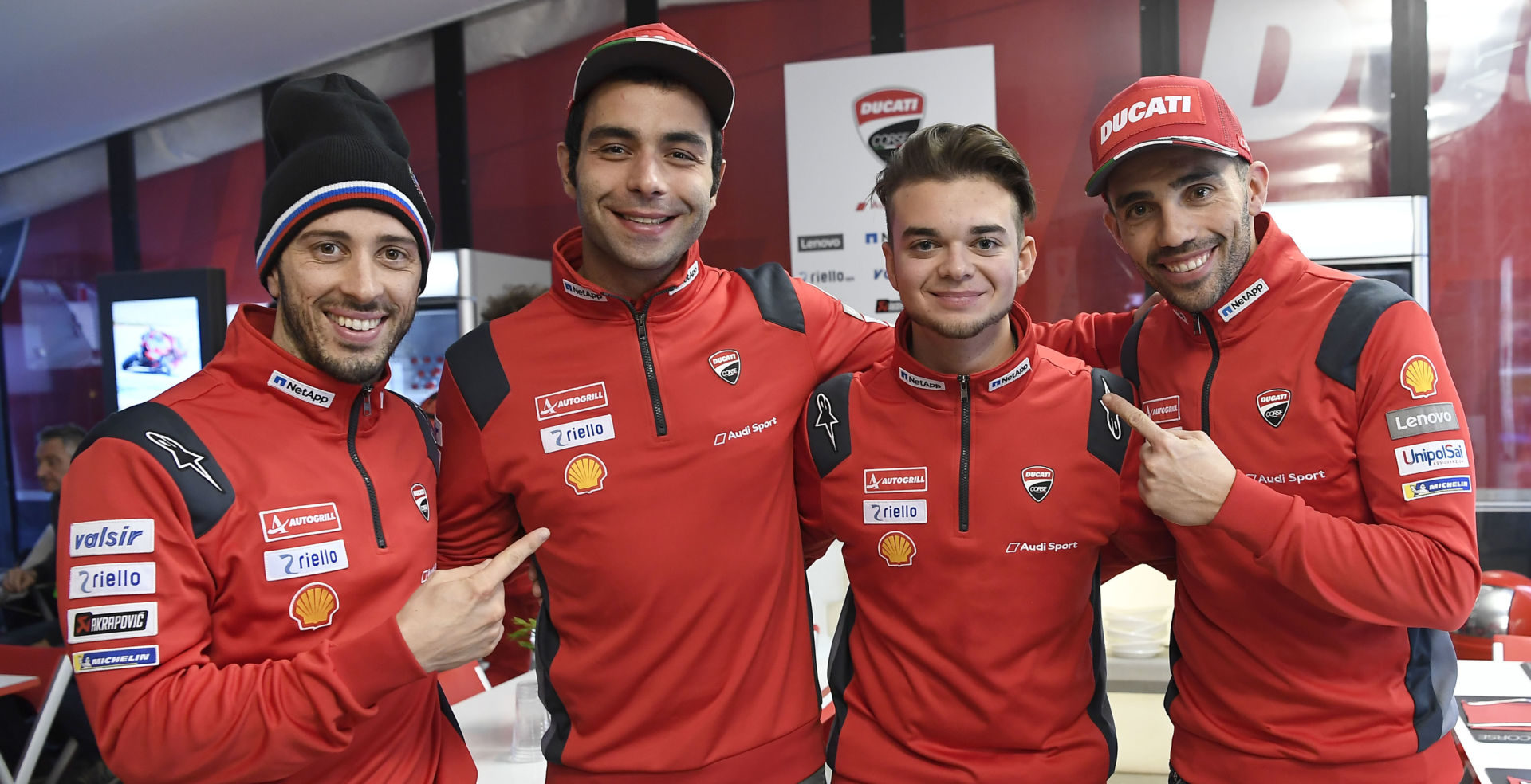 Andrea Saveri (second from right) with Andrea Dovizioso (far left), Danilo Petrucci (second from left), and Michele Pirro (far right). Photo courtesy of Ducati Corse.