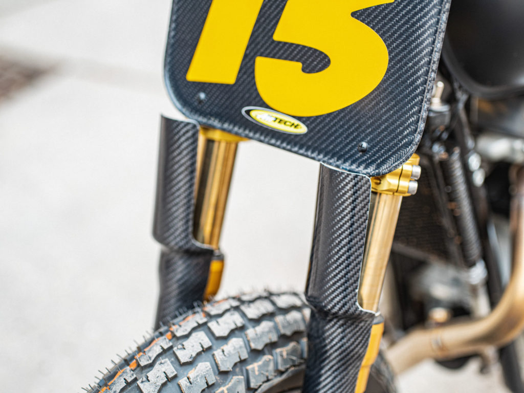 The carbon-fiber number plate and fork guards on Melissa Paris' one-off Royal Enfield INT 650 flat tracker. Photo by Brandon LaJoir, courtesy of Royal Enfield North America.