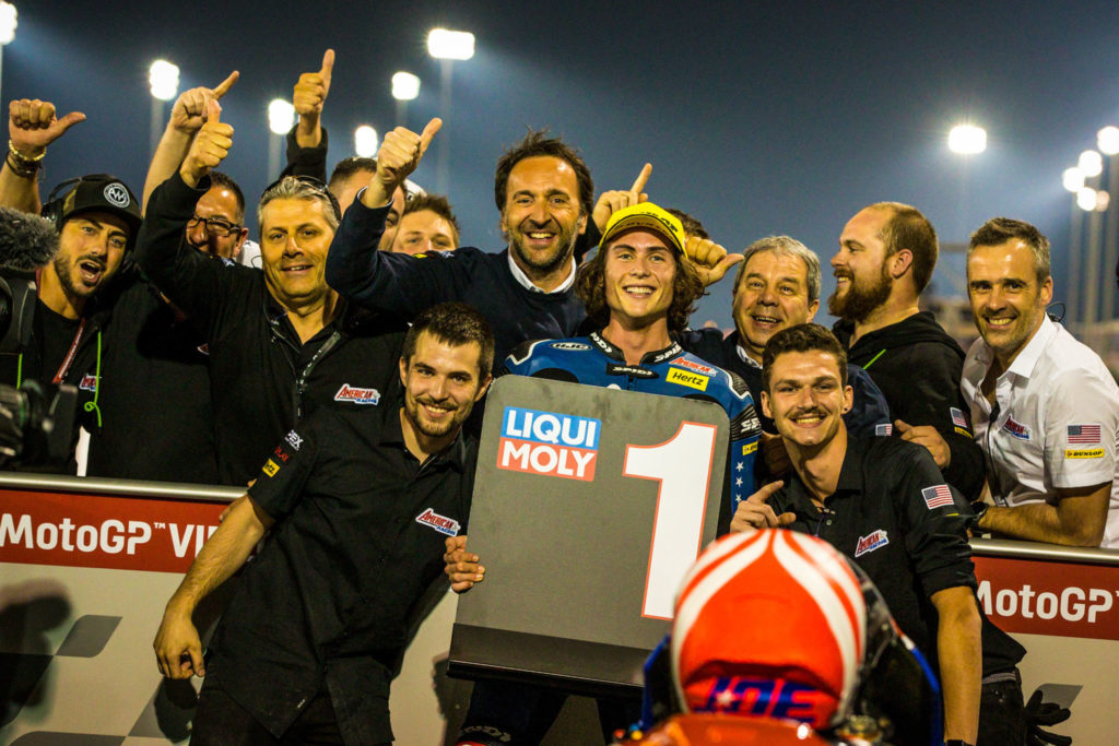 Joe Roberts celebrating his Moto2 pole position in parc ferme with his team in Qatar. Photo courtesy of American Racing Team.