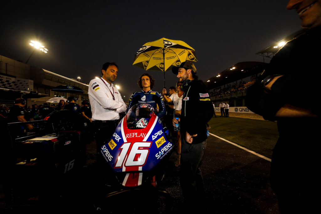 Joe Roberts on the Moto2 grid at Losail International Circuit with his new crew chief Lucio Nicastro (left) and John Hopkins (right). Photo courtesy of American Racing Team.