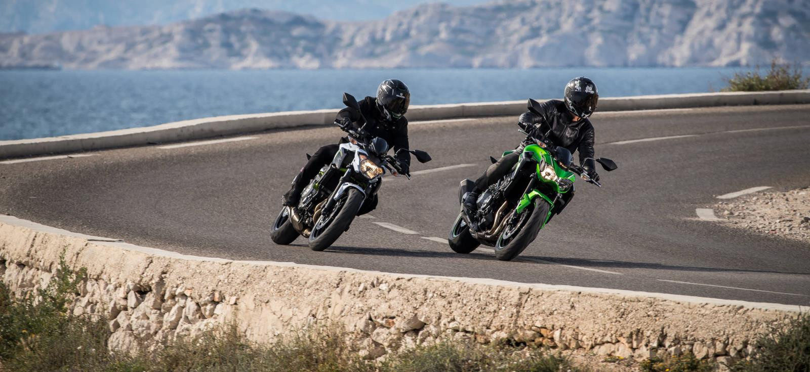 Two motorcyclists on a curvy coastal road. Photo courtesy of Michelin.