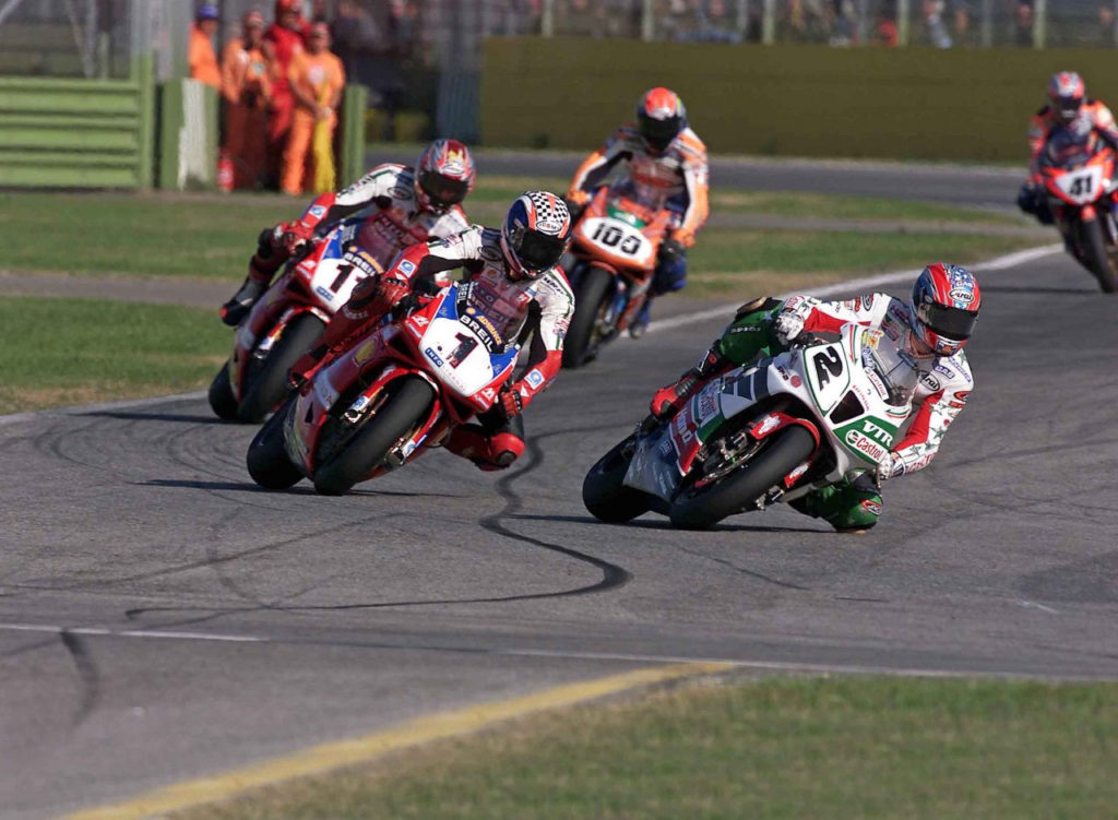 Colin Edwards (2) leading Troy Bayliss (1), Ruben Xaus (11), Neil Hodgson (100), and Noriyuki Haga (41) during a World Superbike race. Photo courtesy of Honda Racing Corporation (HRC).