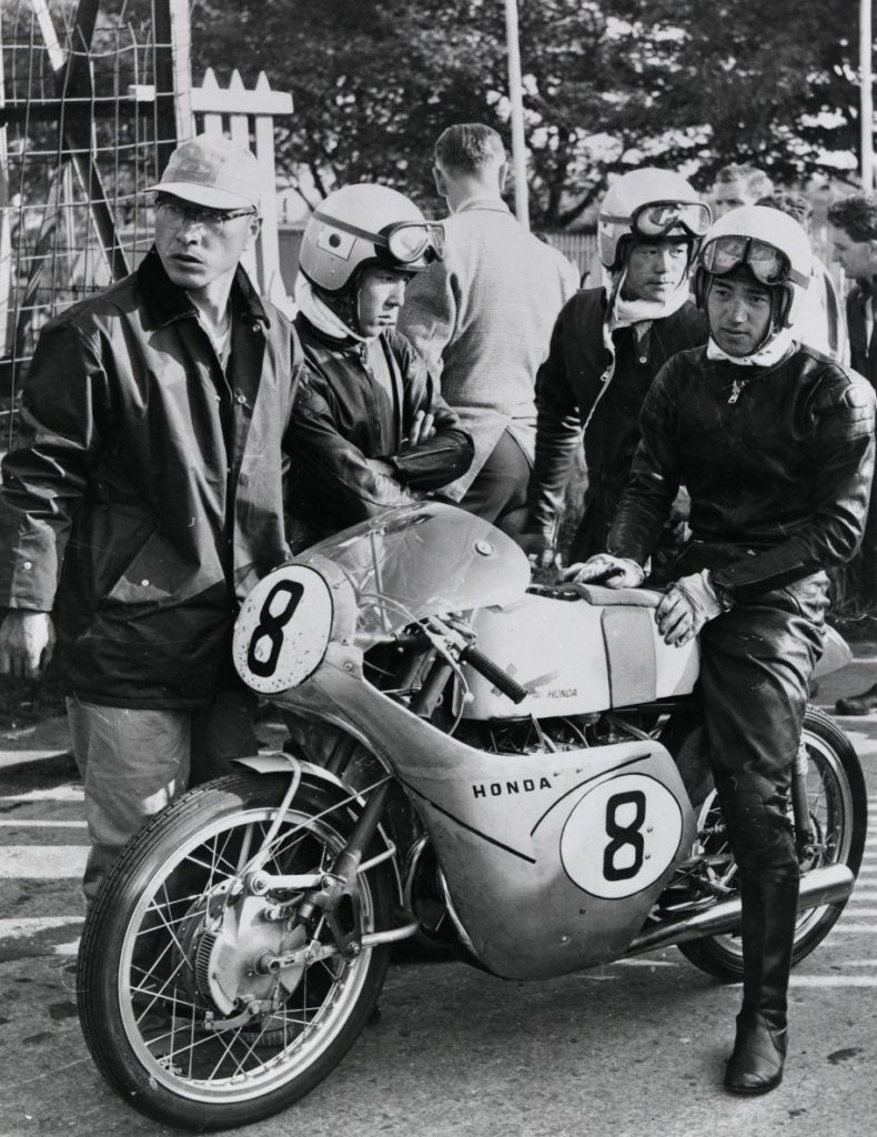 Naomi Taniguichi seated on his Honda RC142 Grand Prix racebike at the Isle of Man TT in 1959. Photo courtesy Honda Pro Racing.