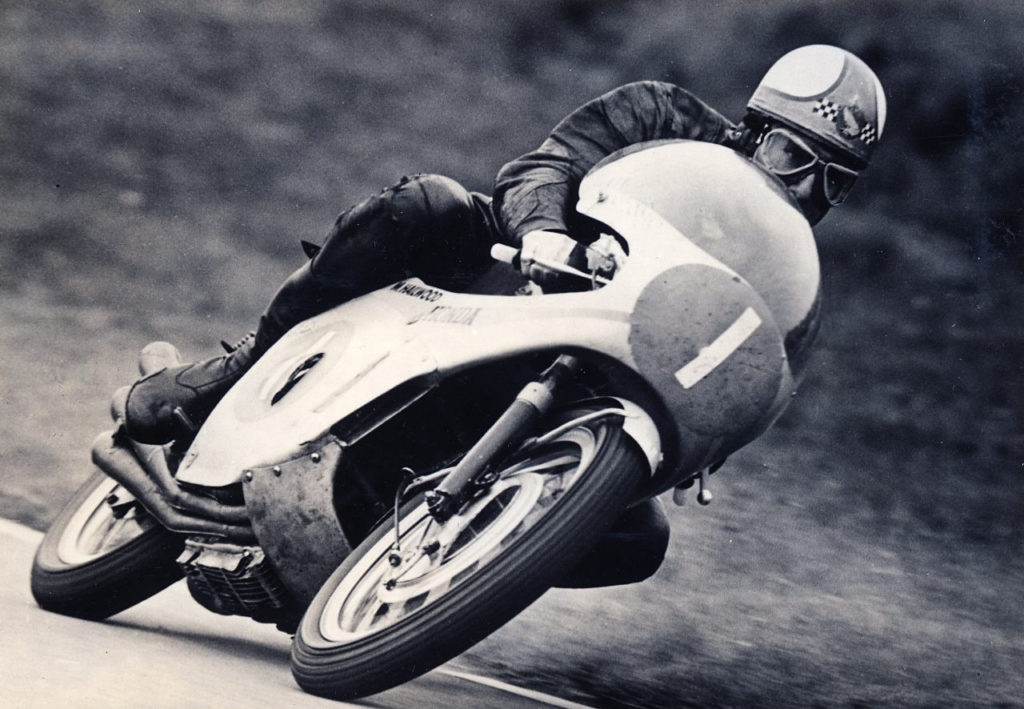 Mike Hailwood (1) at speed on his Honda RC166 , a 250cc six-cylinder machine, in 1967. Photo courtesy Honda Pro Racing.