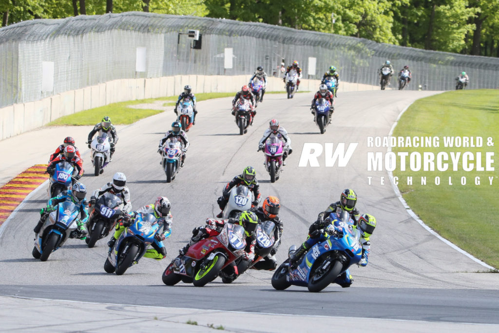 MotoAmerica Twins Cup racers fight for positions on the brakes into Road America’s Turn Five in 2019. Here, Alex Dumas (16) leads Draik Beauchamp (77), Darren James (229), Joseph Blasius (24), Kris Turner (38), Chris Parrish (1), Jeff Tigert (911), Cooper McDonald (120), and the rest of the field. Photo by Brian J. Nelson.