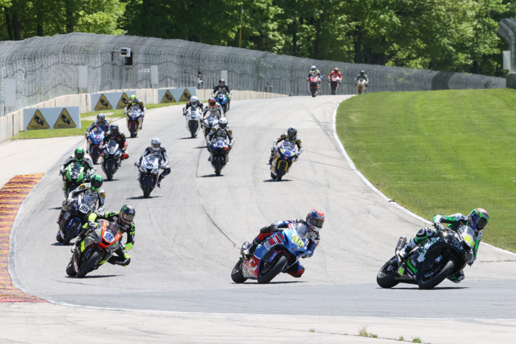 Richie Escalante (54) leads Sean Dylan Kelly (40), Brandon Paasch (21), and the rest of the field during MotoAmerica Supersport Race Two at Road America. Photo by Brian J. Nelson, courtesy MotoAmerica.