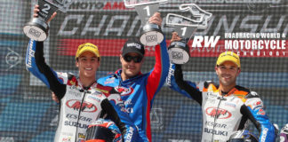 Chris Ulrich (center) on the podium with his riders Bobby Fong (right) and Sean Dylan Kelly (left), after Fong won and Kelly finished second in MotoAmerica Supersport Race Two at Road America in 2019. Photo by Brian J. Nelson.