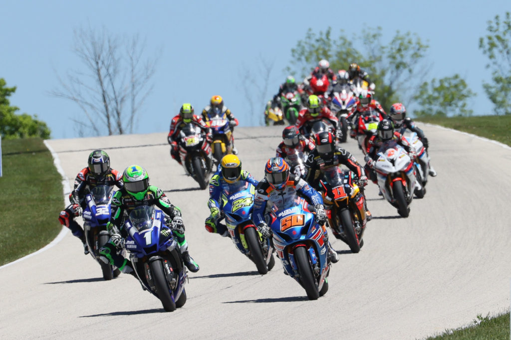 Cameron Beaubier (1) passes Bobby Fong (50) for the lead early in MotoAmerica HONOS Superbike Race Two at Road America. Photo by Brian J. Nelson, courtesy MotoAmerica.