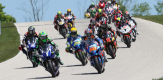Cameron Beaubier (1) passes Bobby Fong (50) for the lead early in MotoAmerica HONOS Superbike Race Two at Road America. Photo by Brian J. Nelson, courtesy MotoAmerica.