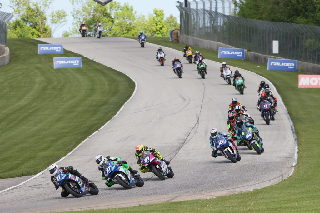Rocco Landers (97) leads Toby Khamsouk (27), Kaleb De Keyrel (51) and the rest of the field early in MotoAmerica Twins Cup Race One. Photo by Brian J. Nelson, courtesy MotoAmerica.