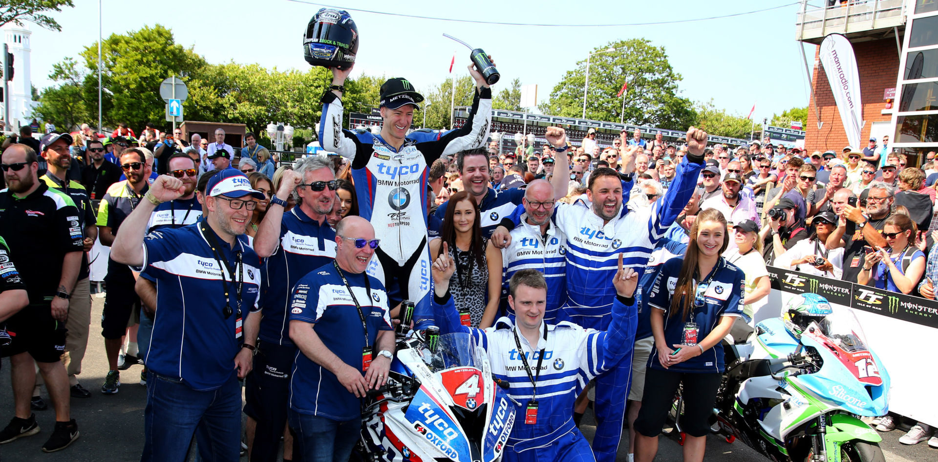 Ian Hutchinson and the TAS Racing team after winning a race at the Isle of Man in 2016. Photo courtesy BMW Motorrad Motorsport.