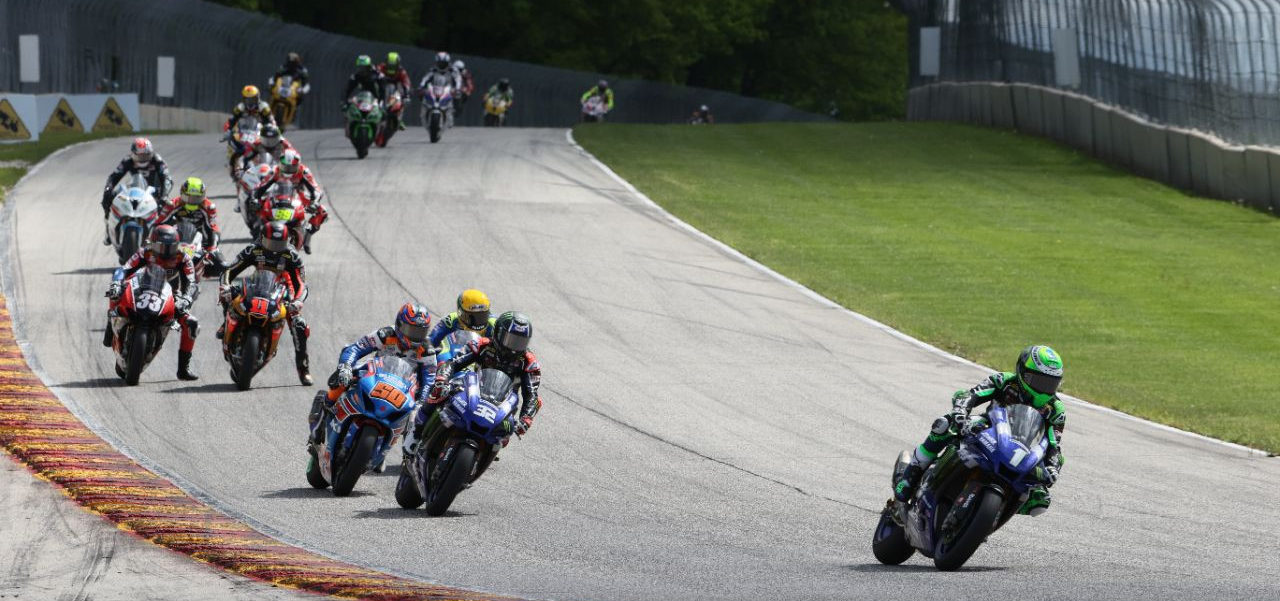 Cameron Beaubier (1) leads Jake Gagne (32), Bobby Fong (50), Toni Elias (behind Gagne), Mathew Scholtz (11), Kyle Wyman (33), and the rest of the MotoAmerica HONOS Superbike field early in Race One at Road America. Photo courtesy of Yamaha.