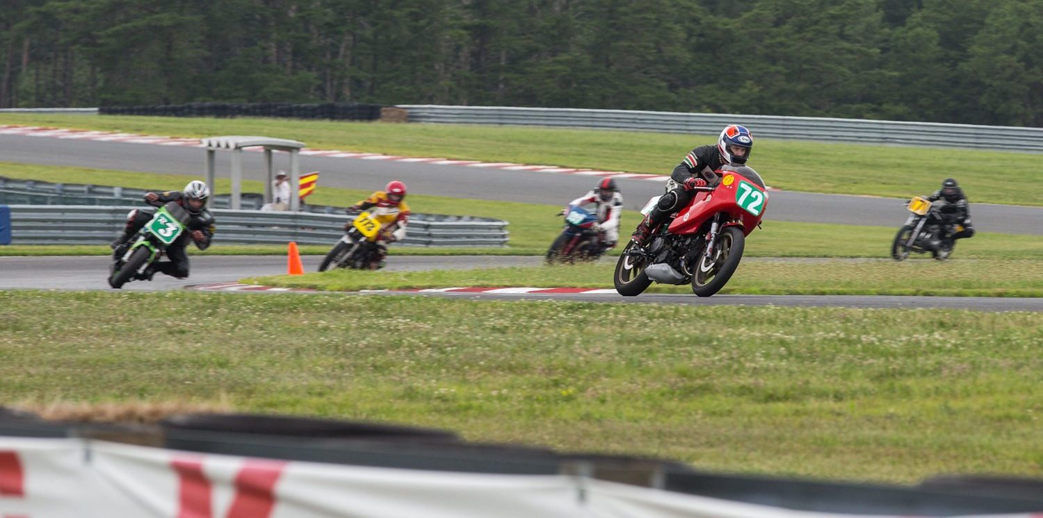 David Eulberg (72) leads a group of riders during a previous AHRMA event at New Jersey Motorsports Park. Photo by Kevin McIntosh, courtesy AHRMA.