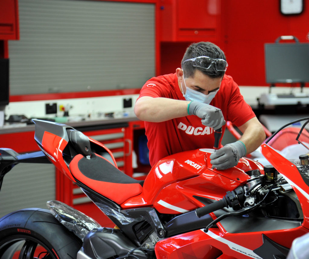 A Ducati worker puts some finishing touches on Ducati Superleggera V4 001 of 500 at the factory in Italy. Photo courtesy Ducati.