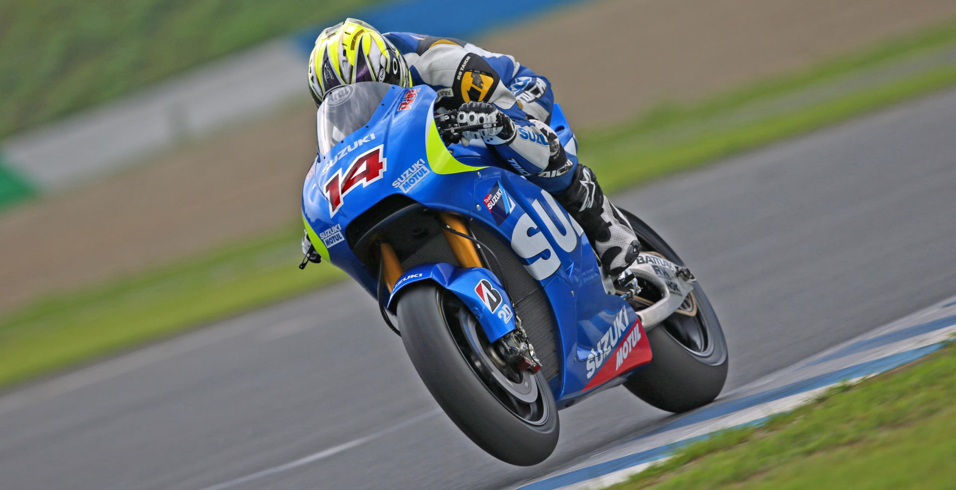 Suzuki test rider Nobuatsu Aoki riding a Suzuki GSX-RR wearing Randy De Puniet’s #14. Photo courtesy of Team Suzuki Press Office.