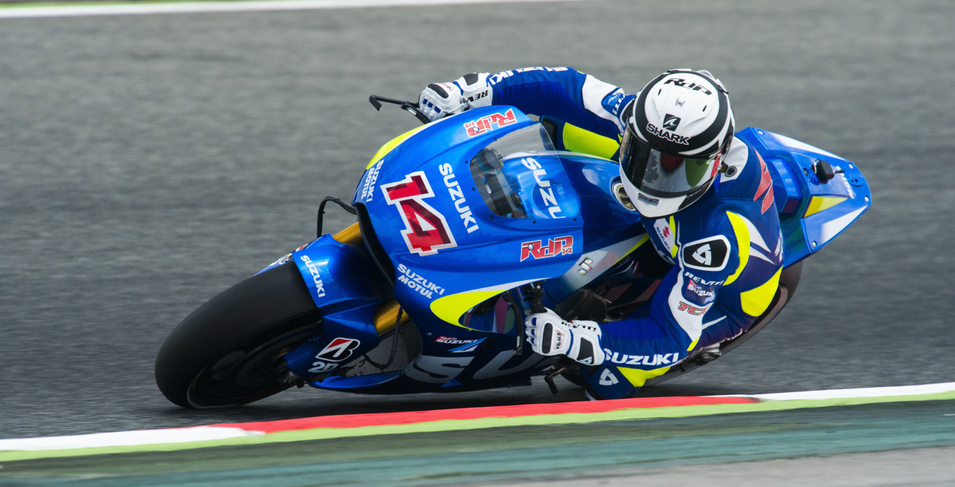 Randy de Puniet (14) in action on the Suzuki GSX-RR MotoGP prototype racebike. Photo courtesy of Team Suzuki Press Office.