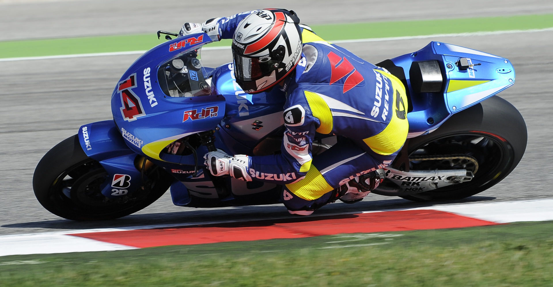 Randy de Puniet (14) testing the Suzuki GSX-RR MotoGP prototype at the Misano Circuit in 2013. Photo courtesy Team Suzuki Press Office.