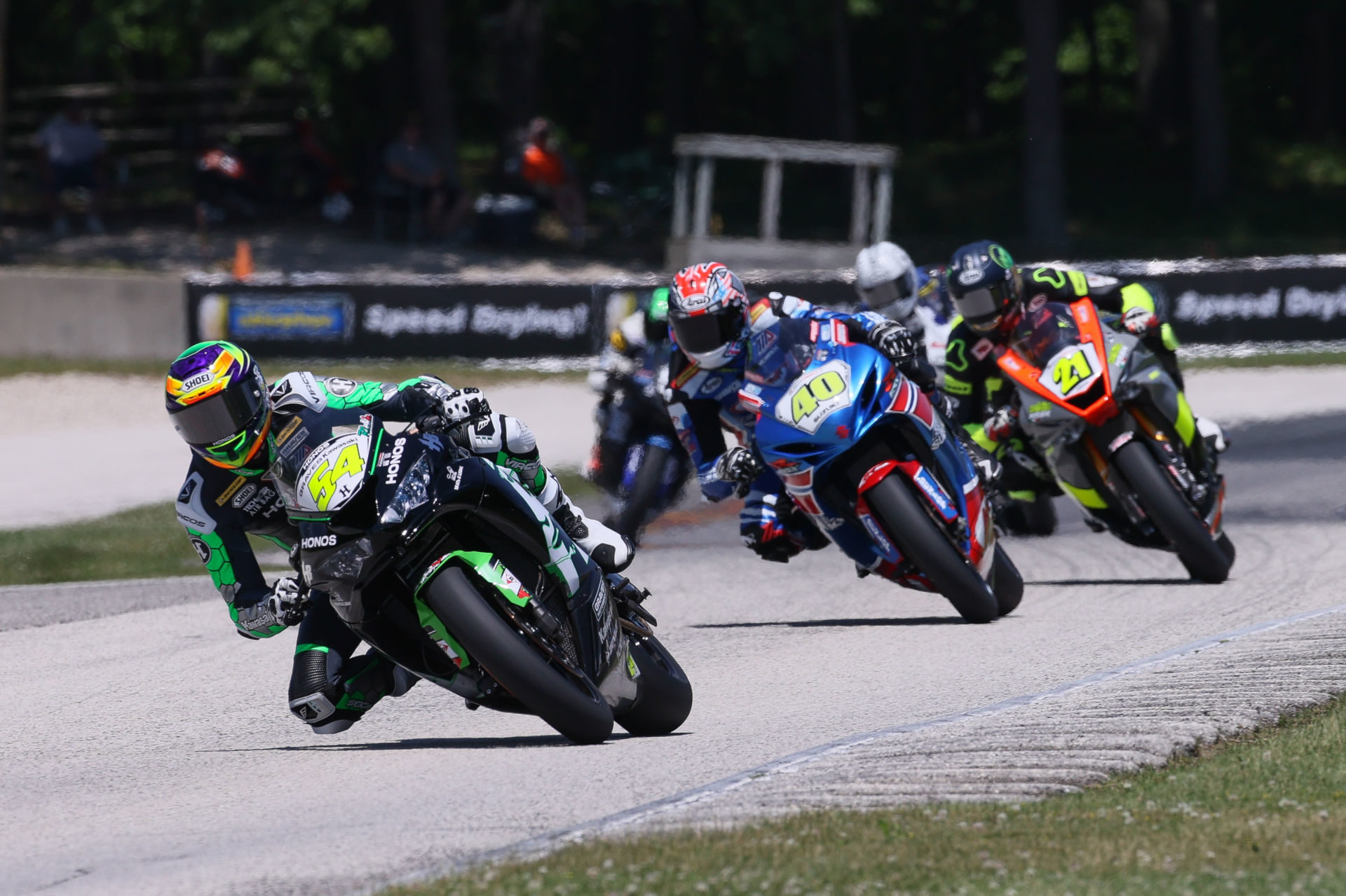 Richie Escalante (54) leads Sean Dylan Kelly (40), Brandon Paasch (21) and the rest of the field during MotoAmerica Supersport Race 2 at Road America. Photo by Brian J. Nelson, courtesy MotoAmerica.