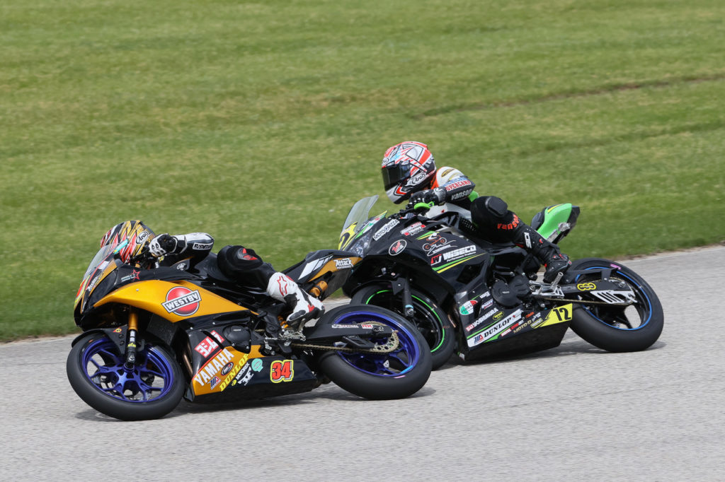 Cody Wyman (34) battles with Benjamin Gloddy (72) during MotoAmerica Junior Cup Race Two at Road America. Photo by Brian J. Nelson, courtesy Westby Racing.