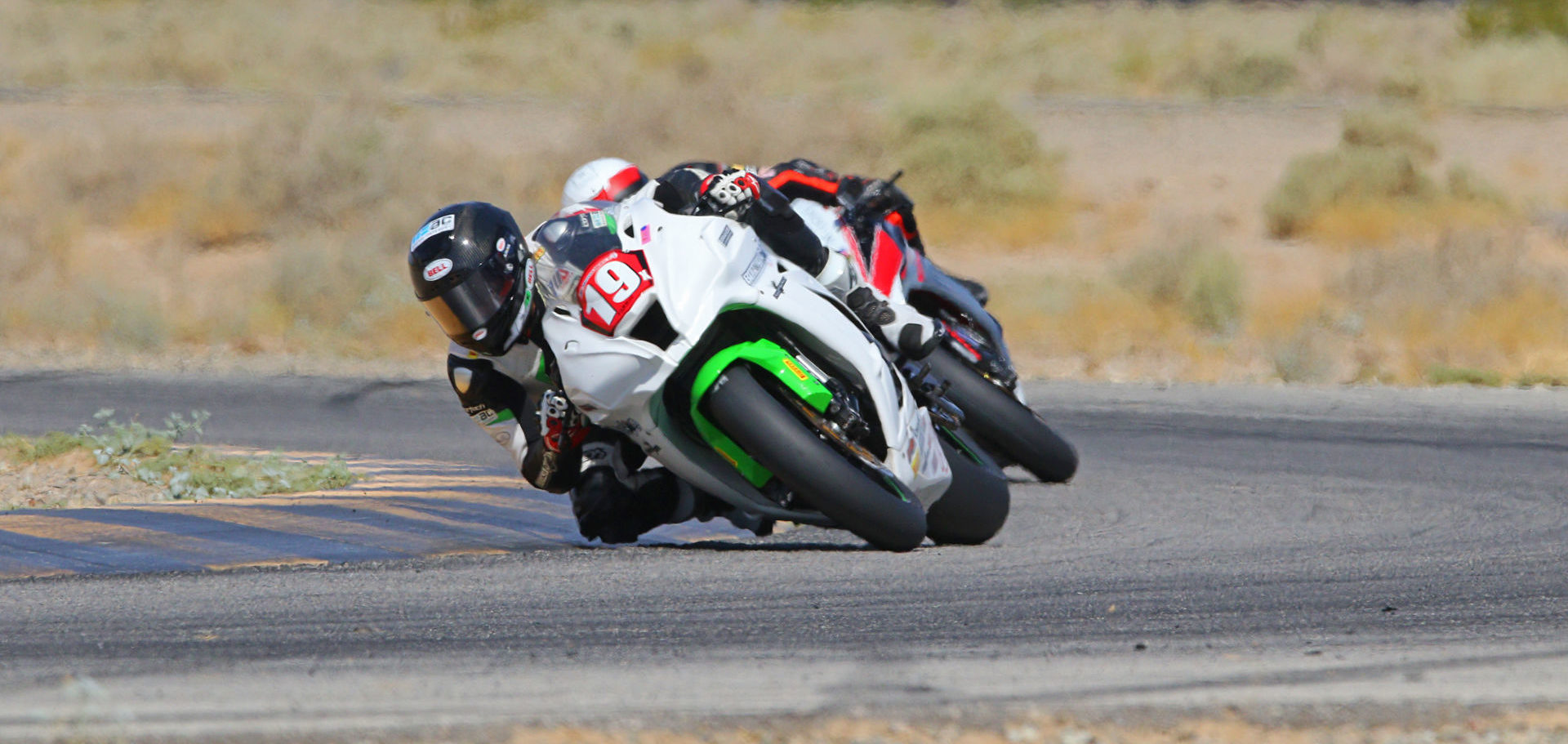 Wyatt Farris (19) leads Chad Lewin during the opening laps of the CVMA Shootout presented by TrackDaz and SoCal TrackDays. Photo by CaliPhotography.com, courtesy CVMA.