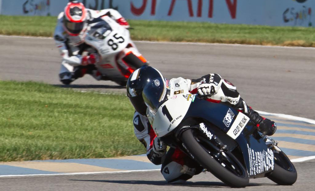 Garrett Gerloff (1) leads Jake Lewis (85) during a USGPRU Moriwaki MD250H Powered by Honda race at Indianapolis Motor Speedway in 2010.