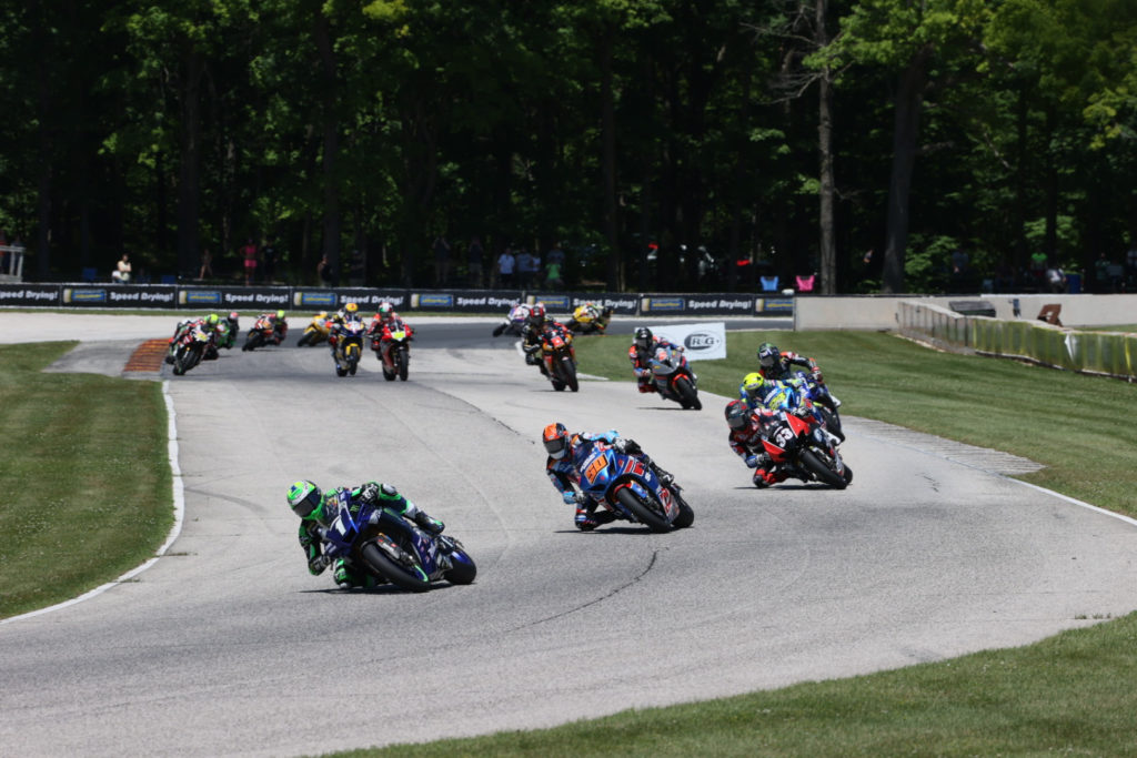 Cameron Beaubier (1) leads Bobby Fong (50), Kyle Wyman (33), Toni Elias (24), Jake Gagne (32), Josh Herrin (2), Mathew Scholtz (11), and the rest of the field early in MotoAmerica Superbike One. Photo by Brian J. Nelson, courtesy MotoAmerica.