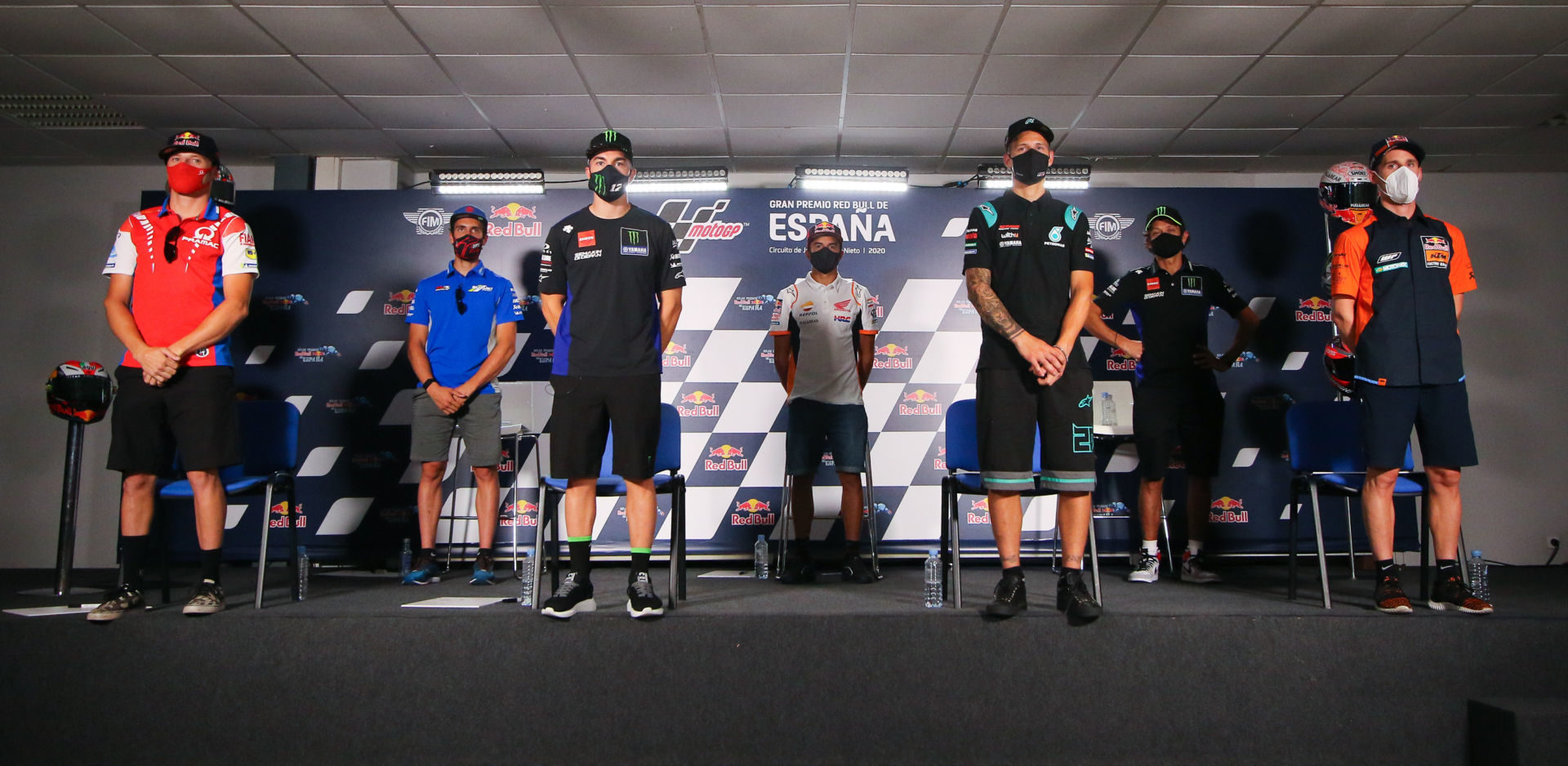 The socially distant MotoGP pre-event press conference at Jerez with (from left) Jack Miller, Alex Rins, Maverick Vinales, Marc Marquez, Fabio Quartararo, Valentino Rossi, and Pol Espargaro. Photo courtesy Dorna.