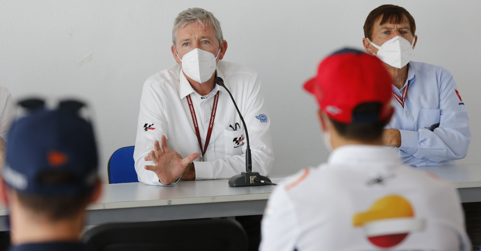 MotoGP Race Director Mike Webb (left), with FIM Steward Bill Cumbow (right), explains to riders at Jerez how the yellow flag rule will be enforced going forward. Photo courtesy Dorna.