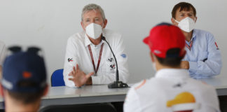 MotoGP Race Director Mike Webb (left), with FIM Steward Bill Cumbow (right), explains to riders at Jerez how the yellow flag rule will be enforced going forward. Photo courtesy Dorna.