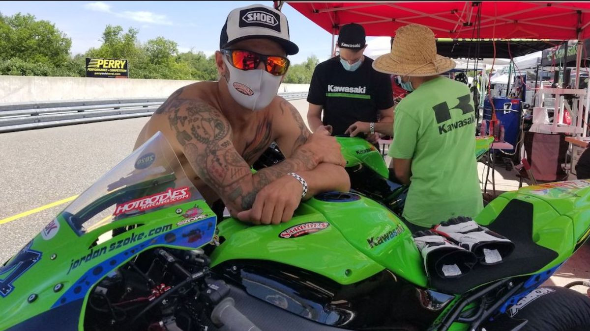 Jordan Szoke (left) in the pits with his Kawasaki ZX-10R at Calabogie Motorsports Park. Photo by Colin Fraser, courtesy CSBK/PMP.