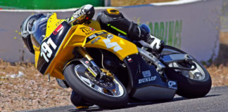 The AGVSPORT Monza boot's ratcheting upper strap holds tight around the leg of a racing suit when the rider is in motion. Photo by Caliphotography.com.