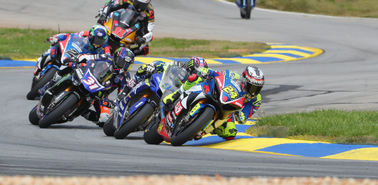 Toni Elias (24) leads JD Beach (95), Garrett Gerloff (31), Josh Herrin (2), Mathew Scholtz (11), and Cameron Beaubier (behind Scholtz) early in a MotoAmerica Superbike race at Road Atlanta in 2019. Photo by Brian J. Nelson, courtesy MotoAmerica.