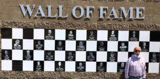 Jere Starks in front of the Wall of Fame at Sonoma Raceway. Photo courtesy Sonoma Raceway.