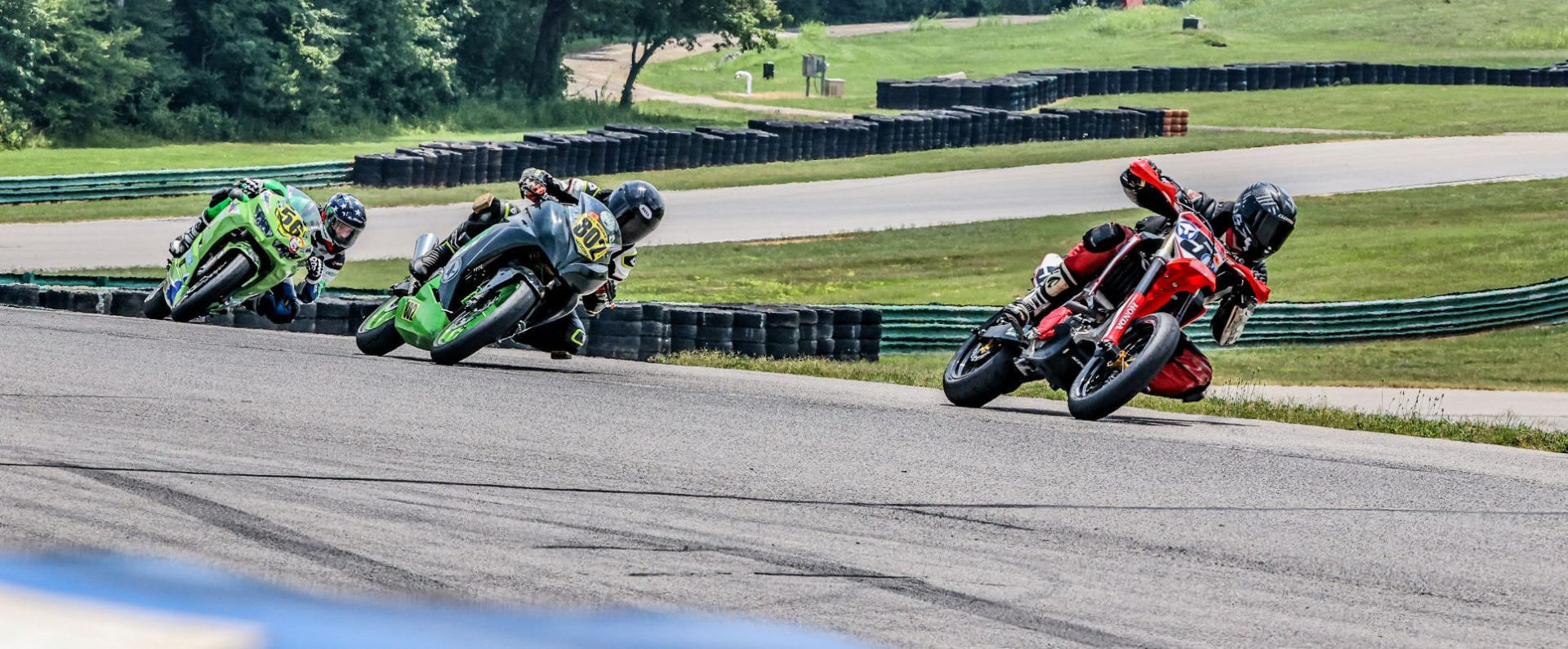 Matt Lamb (5) won both Supermoto Expert races and Will Moore, Jr. (802) won both Superbike 390 Expert races at the Motogladiator round July 5 at VIR Patriot course. Photo by Joshua Barnett/Apex Pro Photo, courtesy Motogladiator.