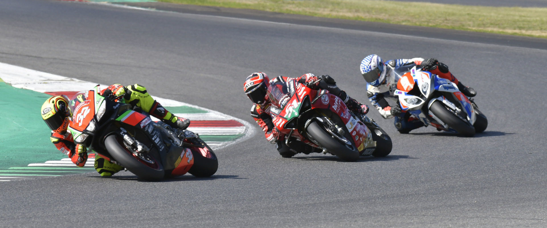 Lorenzo Savadori (32), Michele Pirro (51), and Andrea Mantovani (9) battle during an Elf CIV (Italian) Championship race at Mugello. Photo courtesy Elf CIV Press Office.