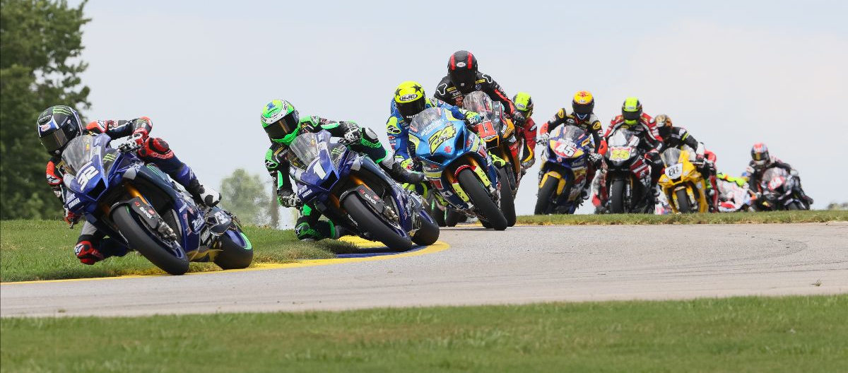 Jake Gagne (32) leads Cameron Beaubier (1), Toni Elias (24), Mathew Scholtz (11) and the rest of the MotoAmerica Superbike field early in Race One at Road Atlanta. Photo by Brian J. Nelson, courtesy MotoAmerica.