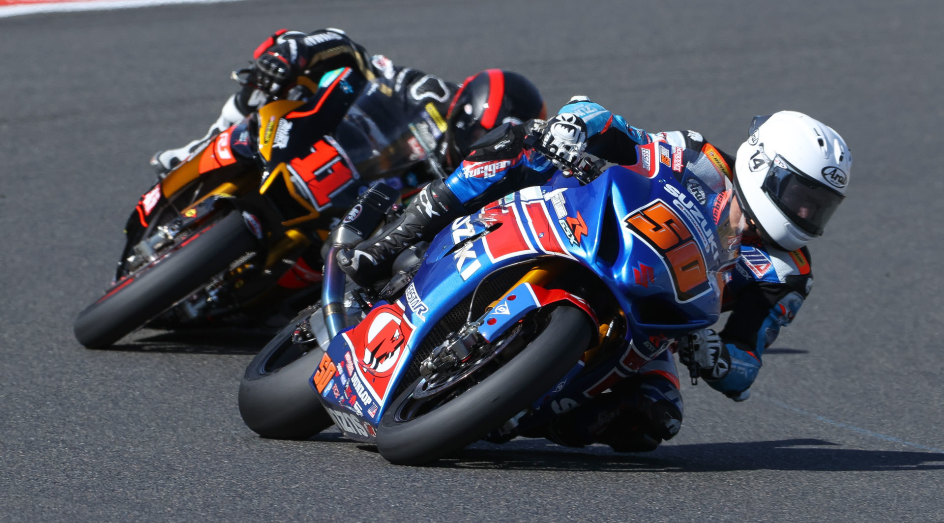 Bobby Fong (50) and Matthew Scholtz (11) battle during a MotoAmerica Superbike race at Ridge Motorsports Park. Photo by Brian J. Nelson, courtesy Westby Racing.