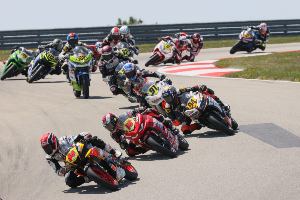 Cody Wyman (34) leading a group of Junior Cup riders at PittRace. Photo by Brian J. Nelson, courtesy Westby Racing.