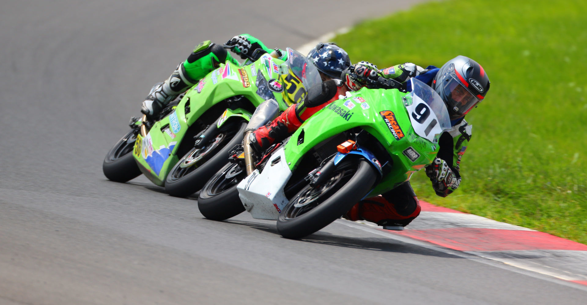 Mark Dickerson (91) and Keegan Brown (56) race for the overall lead in the ASRA Moto 3 Combined race at Summit Point Motorsports Park. Photo by etechphoto.com, courtesy ASRA/CCS.