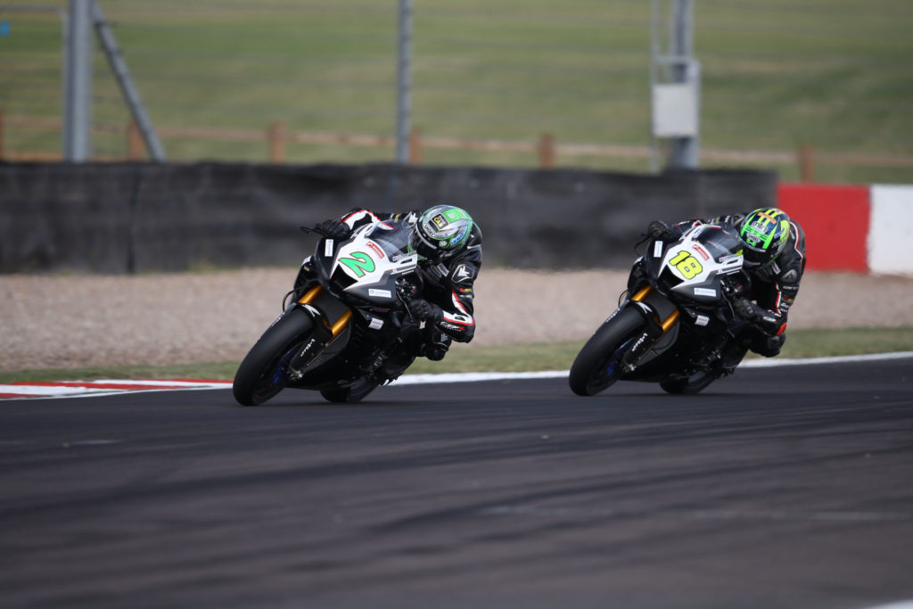 Honda riders Glenn Irwin (2) and Andrew Irwin (18) at speed at Donington Park. Photo courtesy Honda UK.