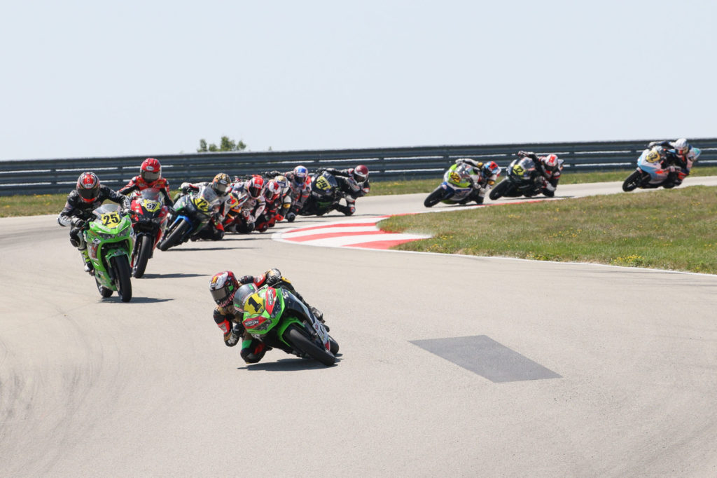 Rocco Landers (1) leads the start of Liqui Moly Junior Cup Race Two at PittRace. Photo by Brian J. Nelson, courtesy MotoAmerica.