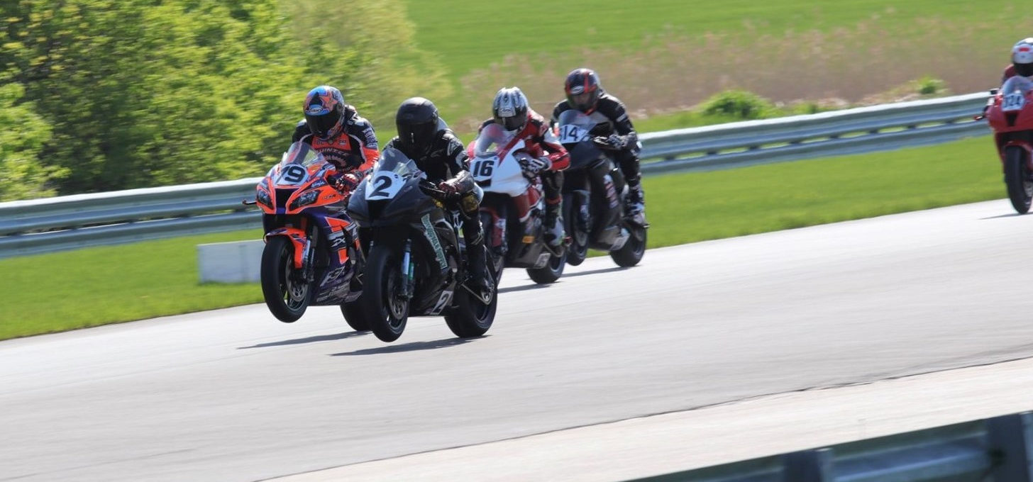 CCS racers Drew Jankord (2), Tony Storniolo (79), Tom Girard (16), and Dustin Bramstedt (814) launch from the grid at Autobahn Country Club. Photo by Ryan Nolan/RyHNoFoto, courtesy ASRA/CCS.