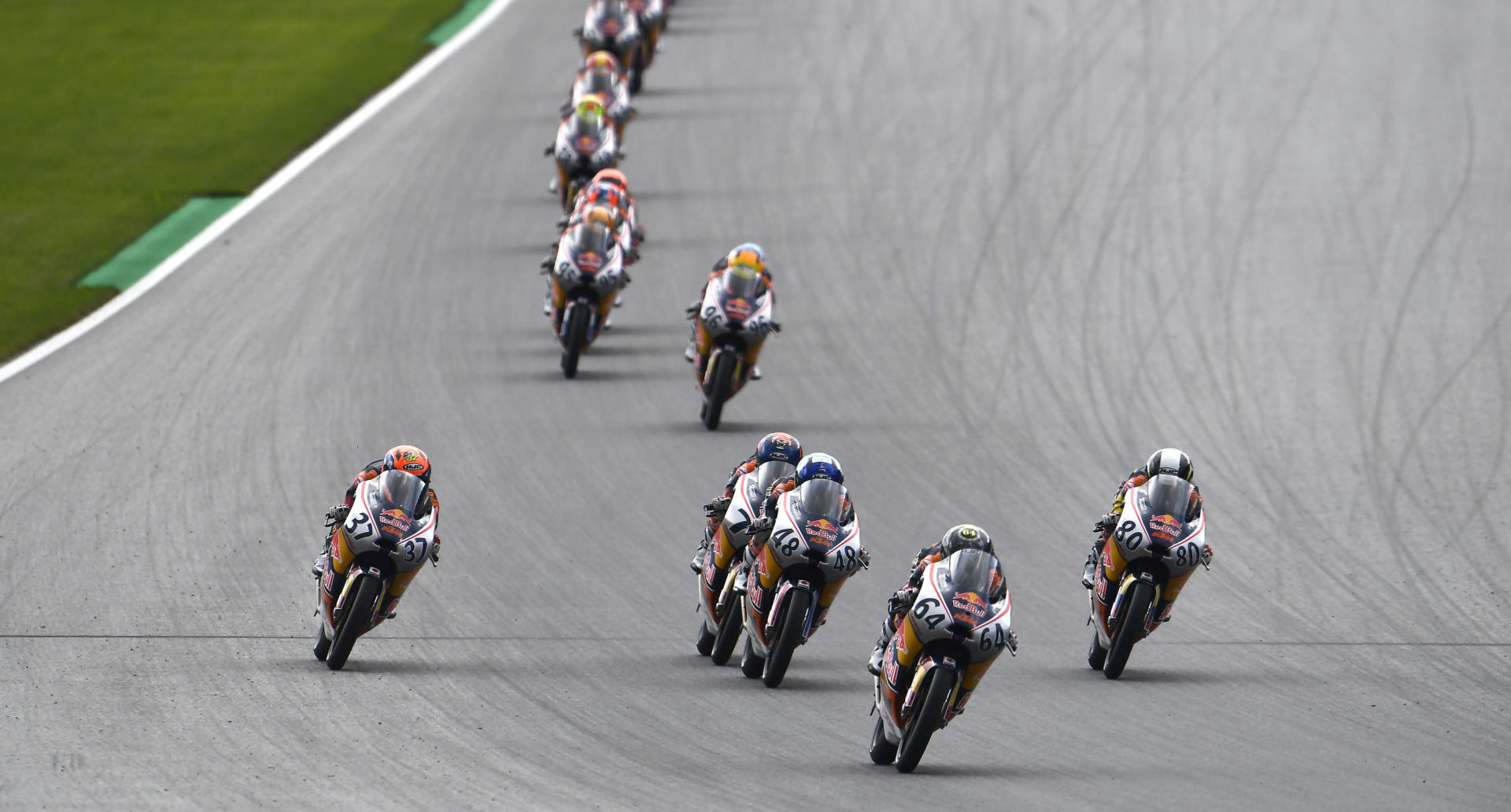 David Munoz (64) leads the field during Red Bull MotoGP Rookies Cup Race One at Red Bull Ring II. Photo courtesy Red Bull.